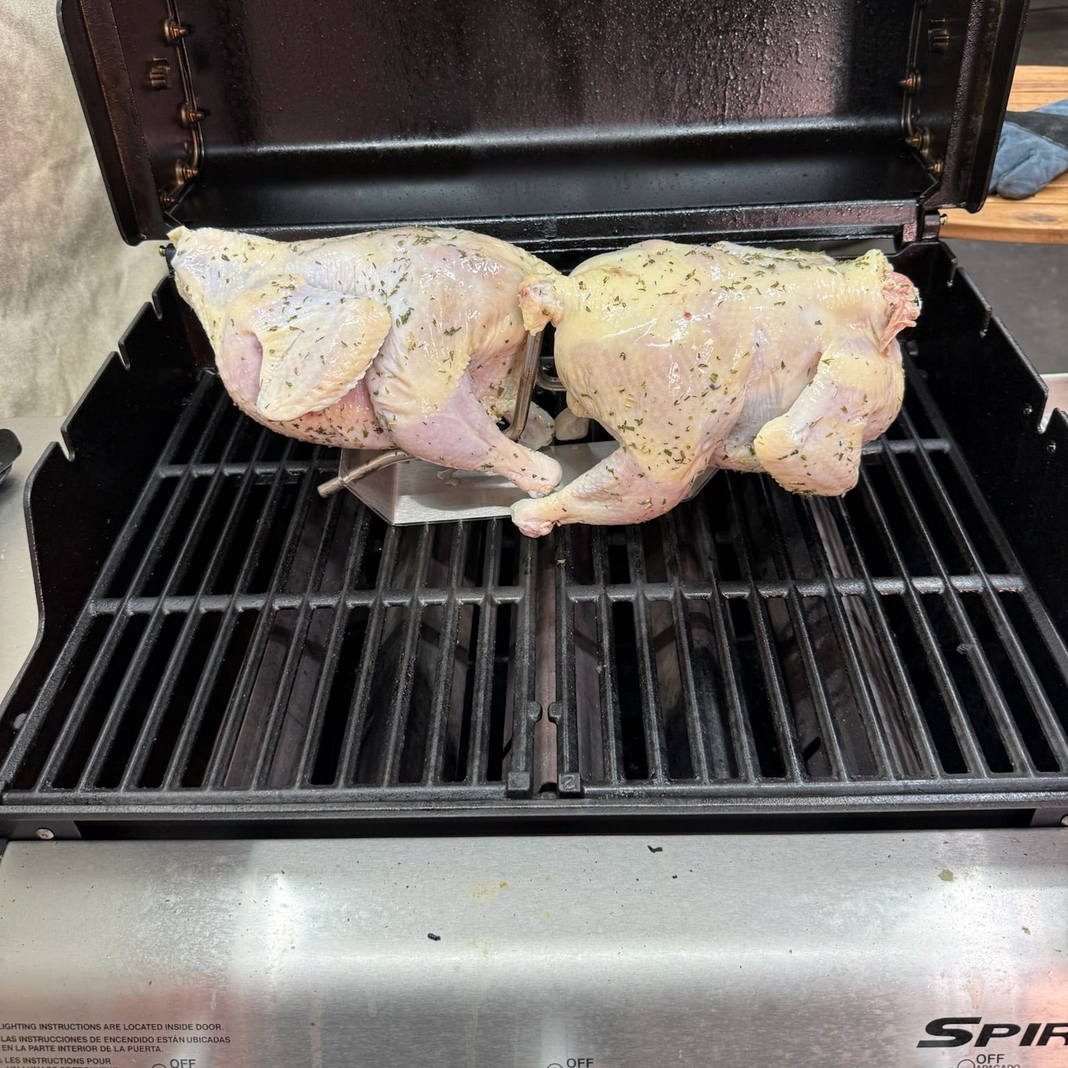 PoulTree Double Coupe with 2 raw chickens on Spirit Grill