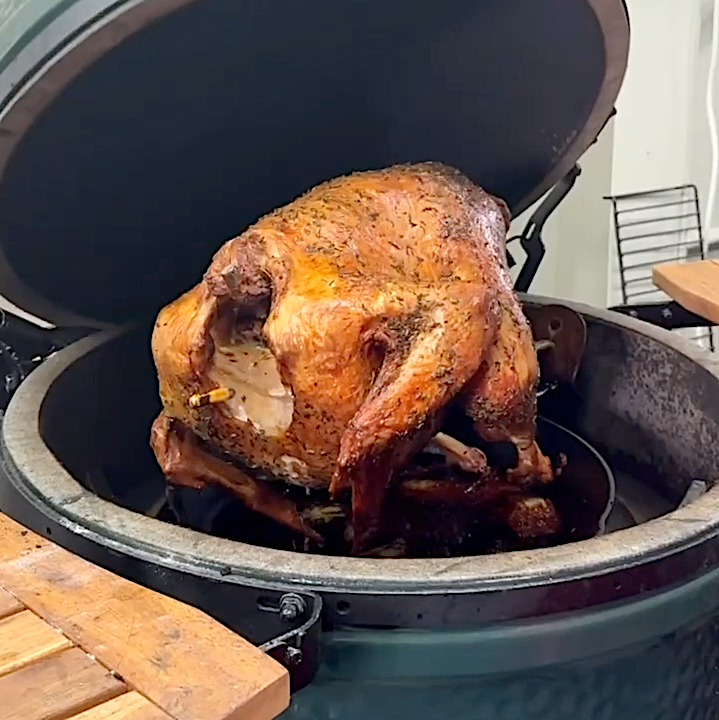 Crispy turkey roasting on a PoulTree rod in a Big Green Egg, Thanksgiving turkey on the grill
